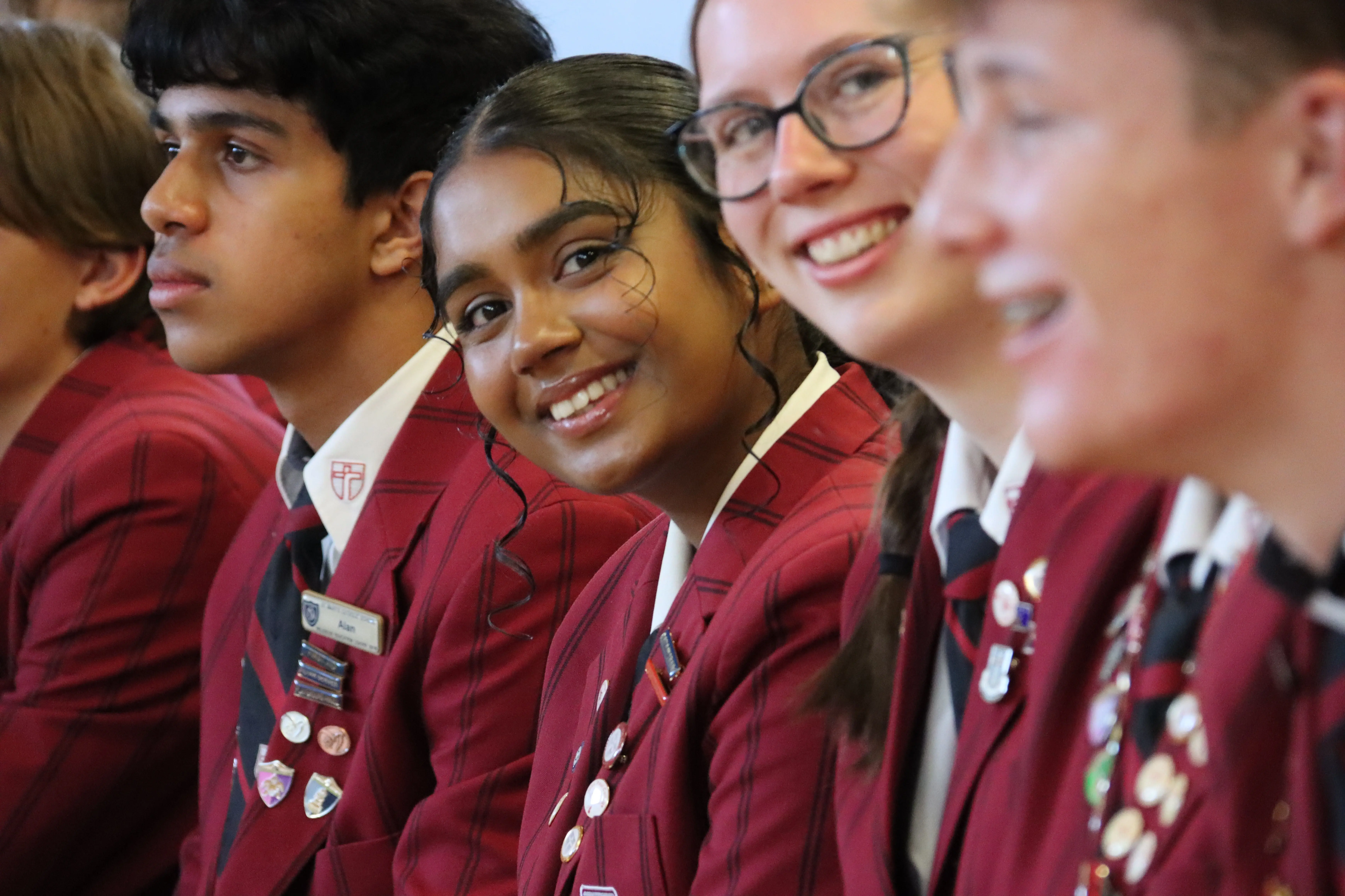 Closeup image of leaders with girls smiling
