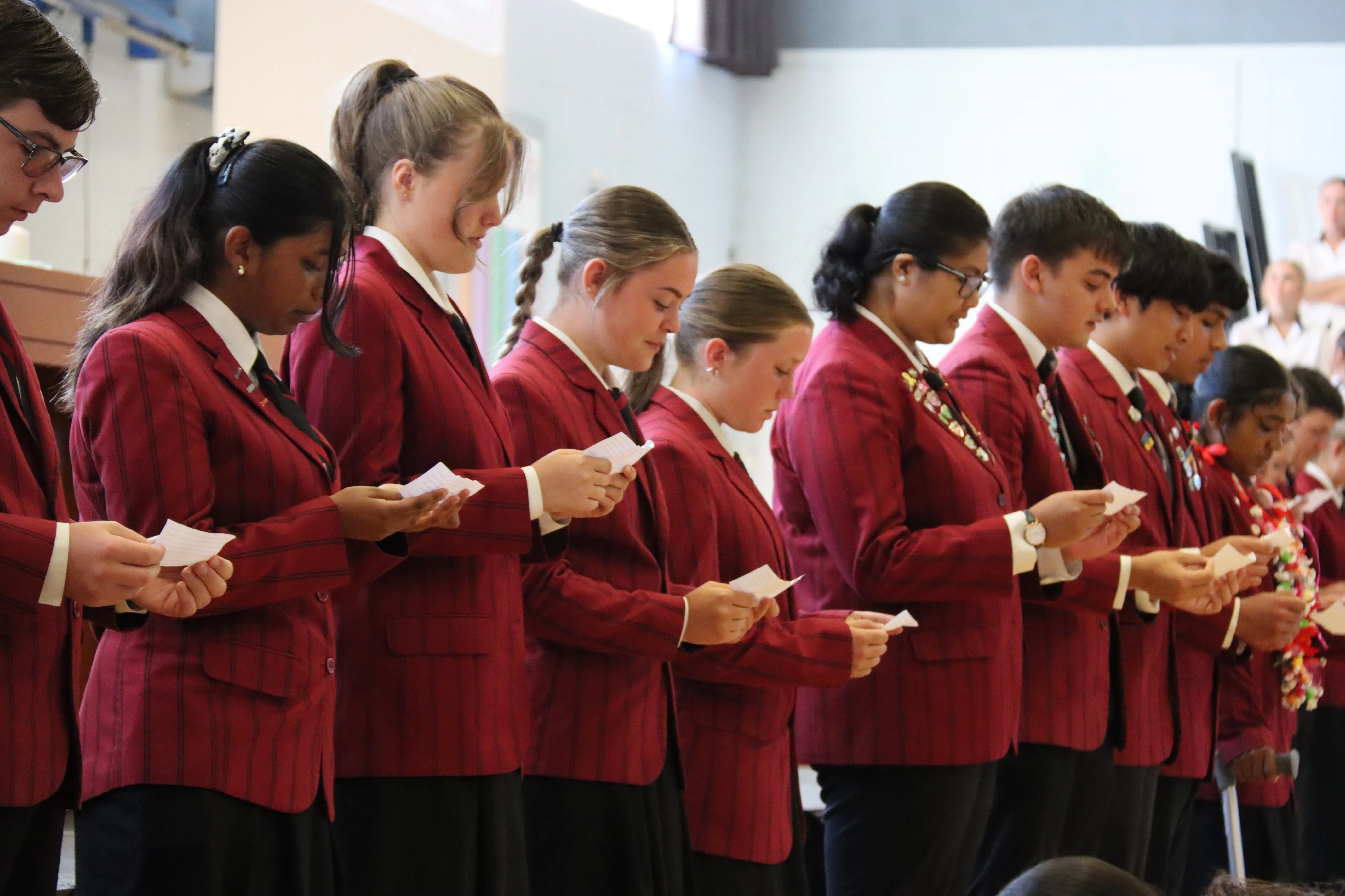 Row of leaders reading from their papers